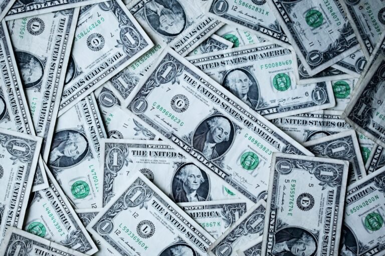 Laptop showing an international money transfer between US and foreign accounts